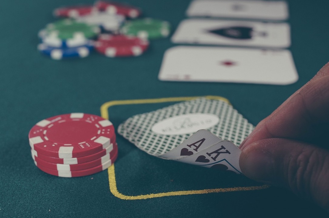 Close-up of poker chips and cards on the table